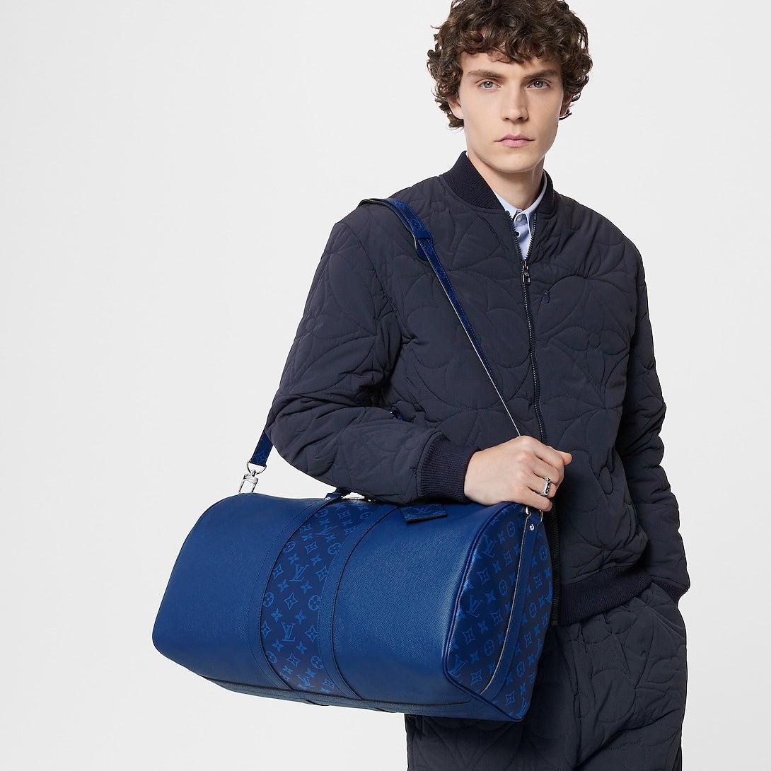 Sac Keepall Bandoulière 50 Louis Vuitton en cuir bleu avec bande centrale Monogram